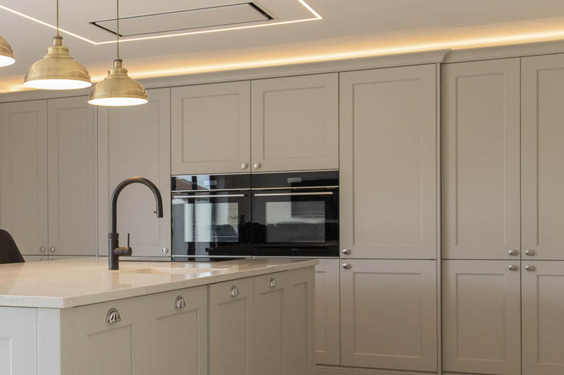 The shaker cabinets contrast beautifully with the kitchen island