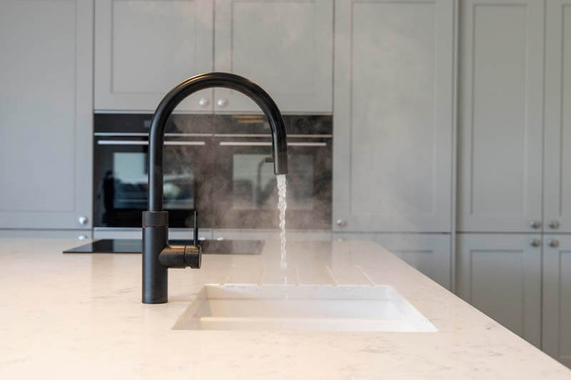 The marble worktop which also houses a built-in sink and Quooker tap