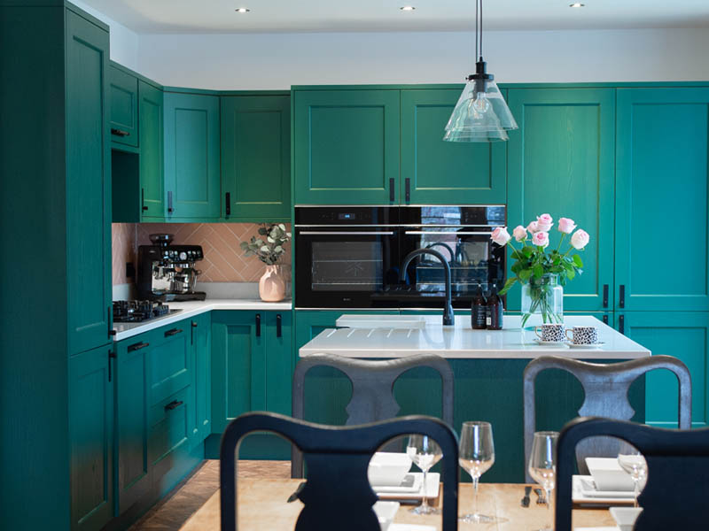 Bold and dark colours continue to be popular kitchen design trends in 202