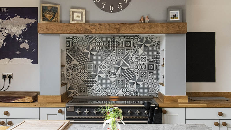 geometric patterned splashback in shaker kitchen