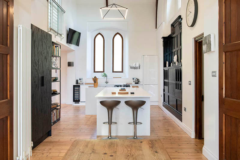 Modern handless kitchen in chapel renovation