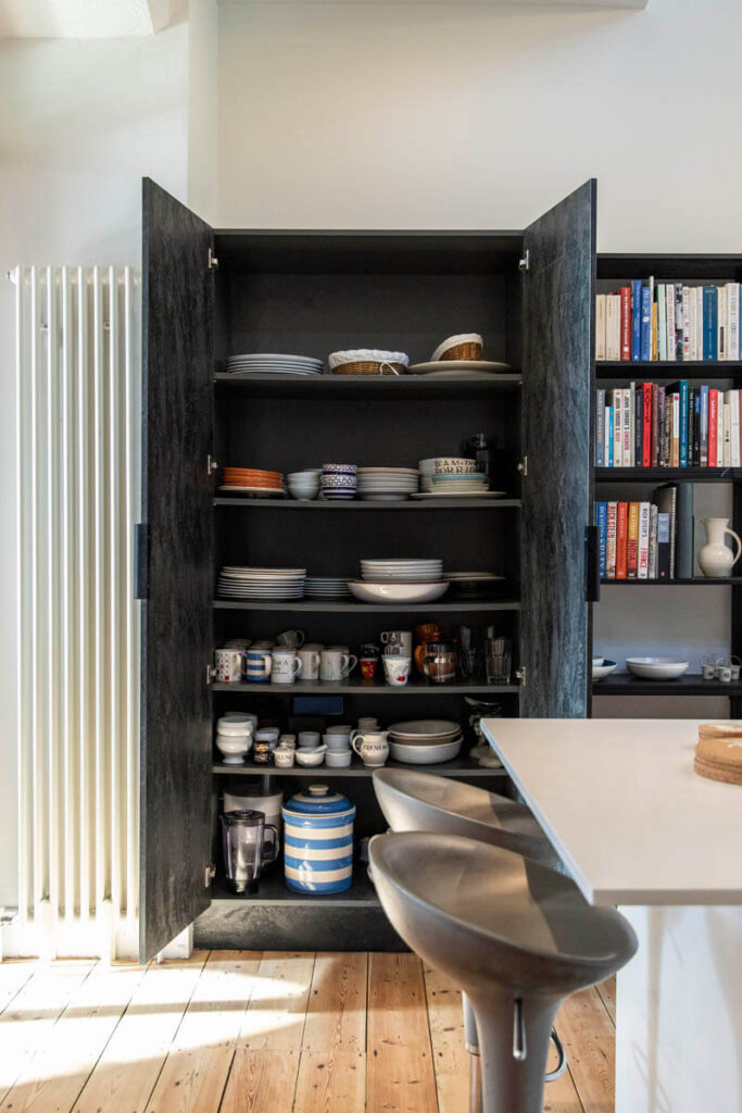 This bespoke storage unit and shelving adds even more character to this kitchen
